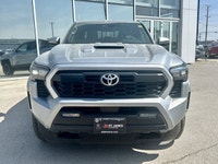 * Suspension: Red TRD sport-tuned shocks for improved on-road handling. * Exterior: 18-inch TRD allo... (image 1)