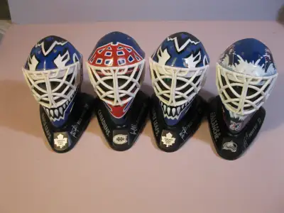 Four McDonalds goalie masks. Colorado (2). Maple Leafs, Canadiens. Includes seven mini Hockey cups