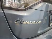 The 2023 Toyota Corolla Hybrid LE in stunning gray, boasts a fuel-efficient FWD drivetrain known for... (image 6)