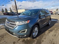 This 2016 Ford Edge SEL finished in Blue with a Black interior pairs a peppy EcoBoost 2.0L Turbo I4... (image 2)