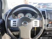 Ready for any adventure or workday, this 2018 Nissan Frontier Crew Cab Pickup in striking Glacier Wh... (image 9)