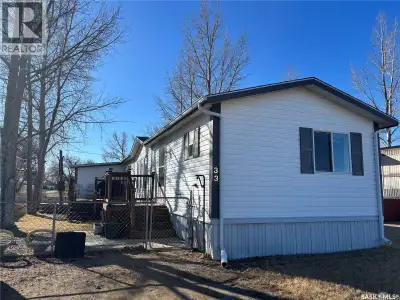 Enjoy the north-facing view of Maple Creek from this inviting mobile home, offering three comfortabl...