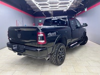 The 2019 Ram 2500 Laramie, with its bold black exterior and sophisticated 4x4 drive, promises except... (image 2)