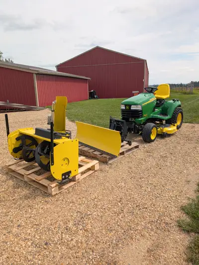 John Deere X585 with 4x4 and 54" mowing deck, View more