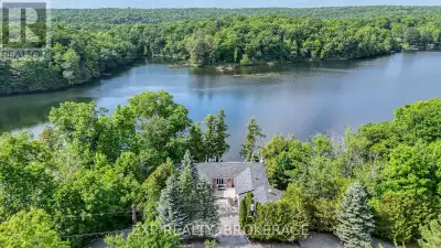 An exceptional multi-family waterfront retreat on the shores of Little Cranberry Lake offering luxur...