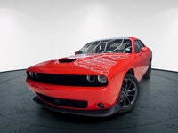Meet the 2022 Dodge Challenger GT in a vibrant orange finish, gracefully combined with an AWD drivet... (image 3)