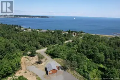 IMMACULATELY RENOVATED COTTAGE SITTING ON 1.5ACRES OF PRIME REAL ESTATE! Located on quiet and privat...