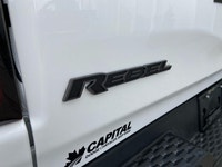 This *2025 Ram 1500 Rebel Crew Cab 4x4* in *Bright White* represents the newest chapter of Ram perfo... (image 9)