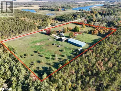 Set on 16 private acres backing onto county forest, this remarkable property blends rural charm with...