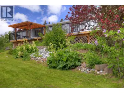 Immaculate rancher with South-facing waterfront on Rose Lake! This enchanting lakefront home offers...