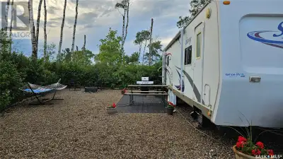 Your summer retreat is here at Deep Woods RV Campground. Complete with 33' 2008 Savoy Trailer this t...