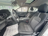 The 2023 Nissan Sentra SV CVT in pristine White is a front-wheel-drive sedan that handles beautifull... (image 6)