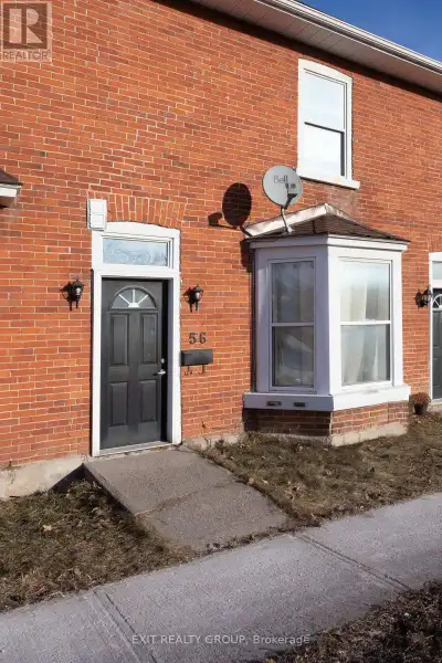 Bright and welcoming, this lovely apartment features a spacious living room with a large by window t...