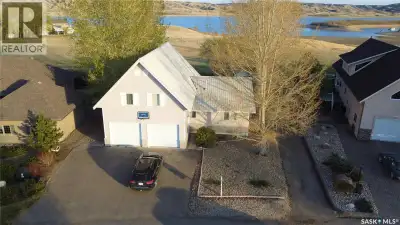 Escape the hustle of city life and embrace the relaxed rhythm of lake living at 130 Marine Drive in...