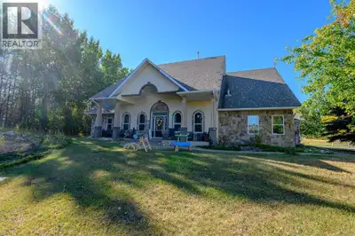 Spectacular setting for this stunning custom-built two-story home, just minutes from Grande Prairie!...