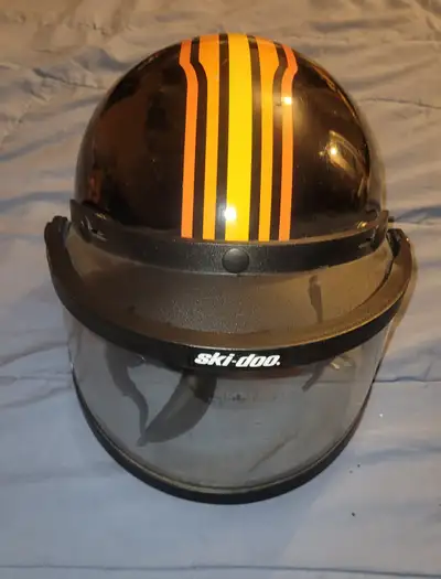 These are collectors items and should not been worn to ride. As if age. 3 vintage Skidoo helments. O...