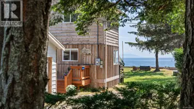 Coveted Curtis Rd walk-on waterfront! Set on a rare & private 0.36-acre lot, this West Coast A-frame...