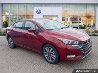 Designed for efficiency and confident urban navigation, this vibrant red 2024 Nissan Versa SV, is yo... (image 5)