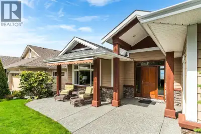 Perched on a quiet cul-de-sac, this custom-built executive rancher is offered for the first time, ca...