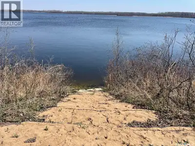 Enjoy direct lakefront access at Dixon Lake! This amazing lot comes with a charming modular home. A...