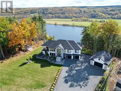 This custom-built Waterfront home is a masterpiece of modern quality & design, w/ over 3,000 sq ft o...