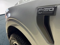 Experience the renowned 2022 Ford F-150 XLT 4x4 SuperCrew in a striking Silver finish, built for bot... (image 1)