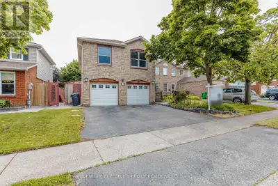 Rare & beautifully updated legal raised bungalow featuring a finished lower level with walk-out to a...