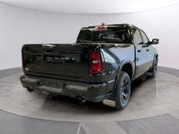 The 2026 Ram 1500 Big Horn 4x4 Crew Cab 57 Box comes in a striking Diamond Black Crystal Pearl finis... (image 4)