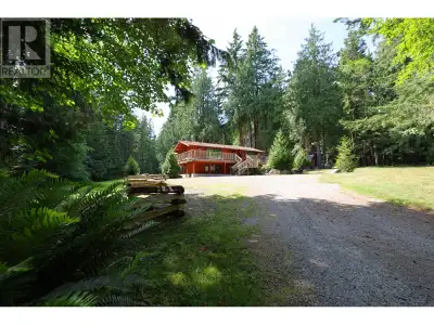 Flat and sunny acreage in Roberts Creek! This cozy 4 bed 2 bath pan-abode home comes complete with b...
