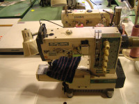 Coverstitch sewing machine, automatic table and electronic motor