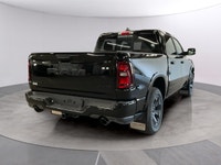 The 2026 Ram 1500 Big Horn 4x4 Crew Cab in a striking black exterior combines rugged durability with... (image 4)