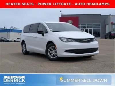 The 2026 Chrysler Grand Caravan SXT in Bright White with a Black interior combines modern styling, e...