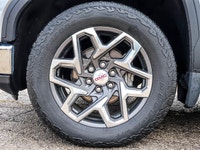 The 2023 GMC Sierra 1500 SLT Crew Cab Short Box 4-Wheel Drive in a refined gray finish offers except... (image 5)