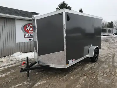 IRON LITE SERIES 6' X 12' SINGLE AXLE CARGO TRAILER WITH REAR RAMP DOOR AND POLYCORE PANELS! Unlock...