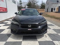 A modern and efficient compact sedan with a refined interior, advanced safety features, and smooth t... (image 1)