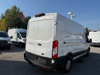 Ready for work. This mid roof transit has power options, divider, bluetooth, a/c, back up camera and... (image 5)