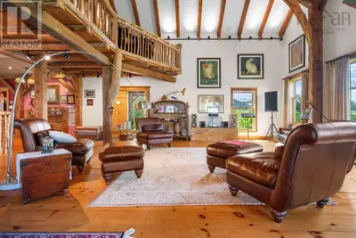 Uncover the unparalleled charm of this extraordinary 4-bedroom + loft, 5-bath timber frame home, met...
