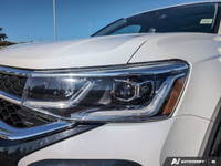 The 2024 Volkswagen Taos Highline, finished in a pristine white, comes equipped with an all-wheel-dr... (image 8)
