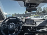 Experience enhanced visibility and an open-air feel in this stunning red 2021 Nissan Rogue SV, featu... (image 9)