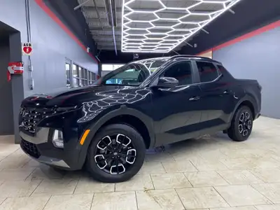 The 2023 Hyundai Santa Cruz Preferred AWD in sleek black offers an extraordinary driving experience...