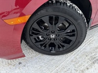 The 2025 Honda Odyssey Black Edition in a striking Red finish, equipped with a Front-Wheel Drive, of... (image 9)