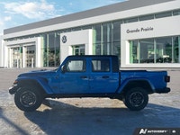 Conquer every landscape in this 2023 Jeep Gladiator Rubicon, gleaming in Hydro Blue Pearl. With only... (image 1)