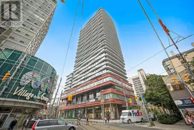 One bedroom condo unit featuring a modern, sleek kitchen and floor-to-ceiling windows. Overlooking t...