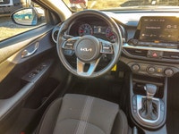 Experience the sophisticated charm of the 2024 Kia Forte LX IVT, presented in a sleek Gray finish wi... (image 8)