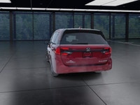 The 2025 Honda Odyssey Black Edition in a striking Red finish, equipped with a Front-Wheel Drive, of... (image 6)