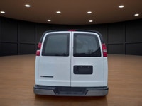 The 2020 Chevrolet Express Cargo Van 2500 Extended Wheelbase in a clean White finish, paired with re... (image 4)