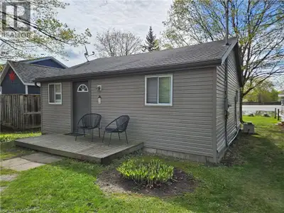 Imagine a quiet 4 season waterfront cottage just minutes from Kitchener, tucked on a private lot nea...