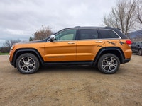 Introducing the stunning 2019 Jeep Grand Cherokee Limited 4x4, a vibrant orange SUV that promises an... (image 3)