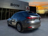 The 2025 Mazda CX-90 MHEV GS-L in a sophisticated gray finish beckons those seeking a premium drivin... (image 6)