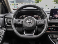 The 2023 Nissan Rogue AWD S in a sleek black hue complements its AWD capabilities, delivering a smoo... (image 9)